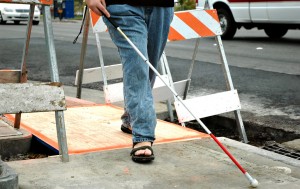 blind-person-navigating sidewalk under construction